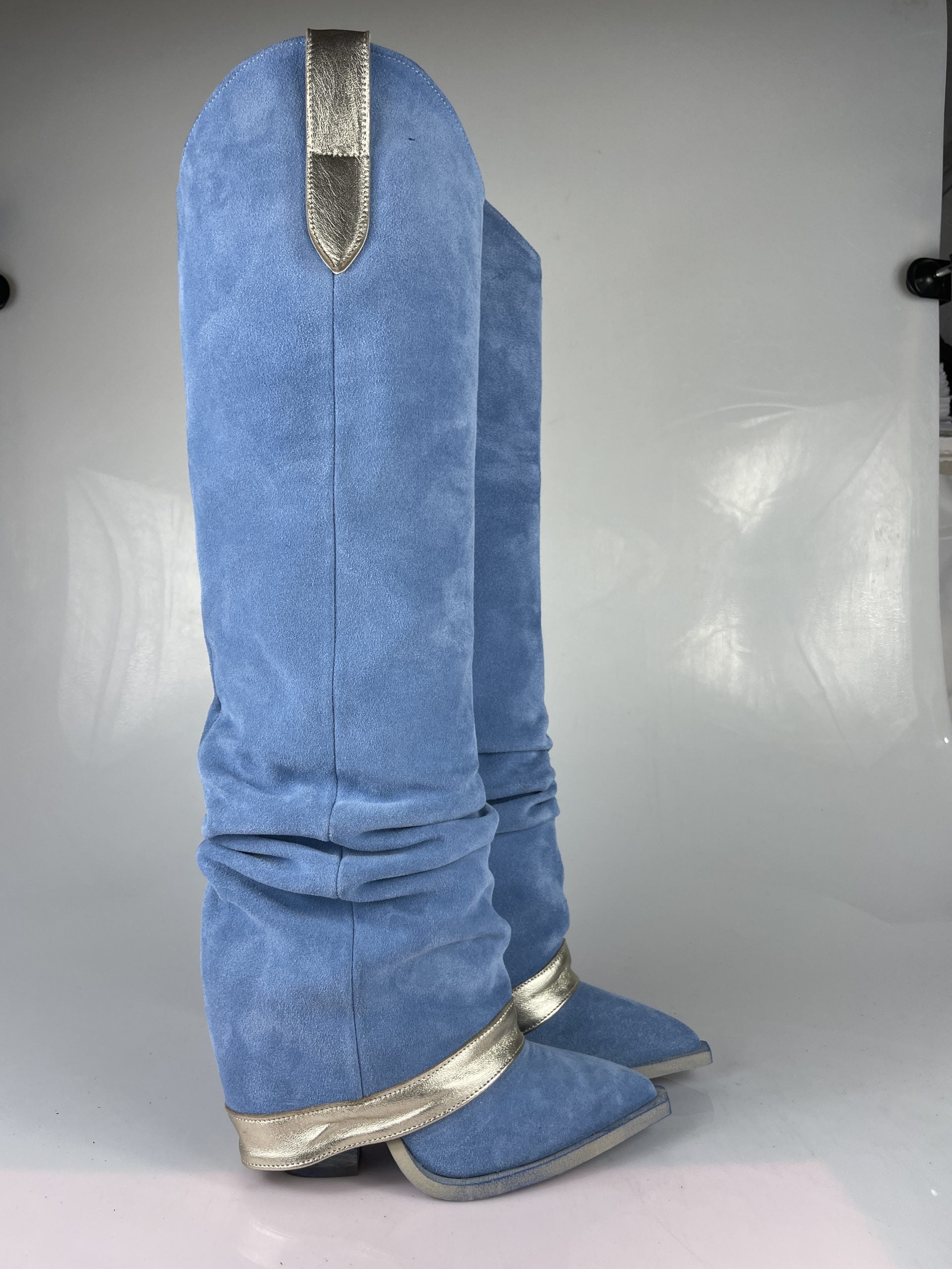 Gabriella clinging to light blue chamois