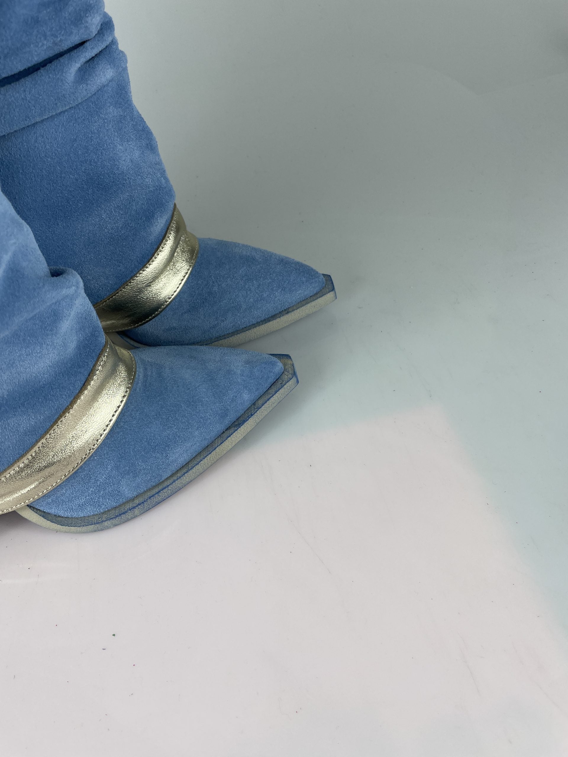 Gabriella clinging to light blue chamois